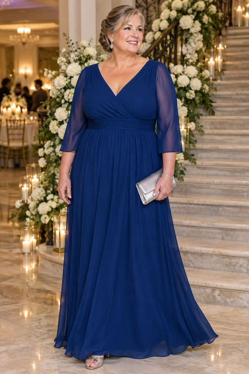 Navy Blue Formal Wrap Dress A woman wearing a navy blue floor-length wrap dress with sheer three-quarter sleeves, silver sandals, and a silver clutch.